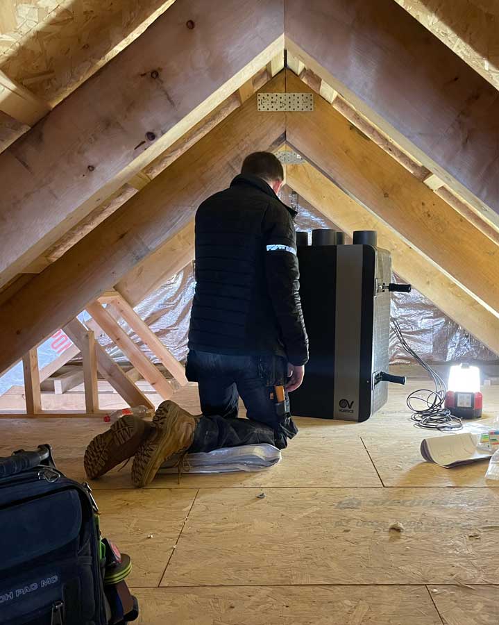 Ricki working on site on a ventilation project.